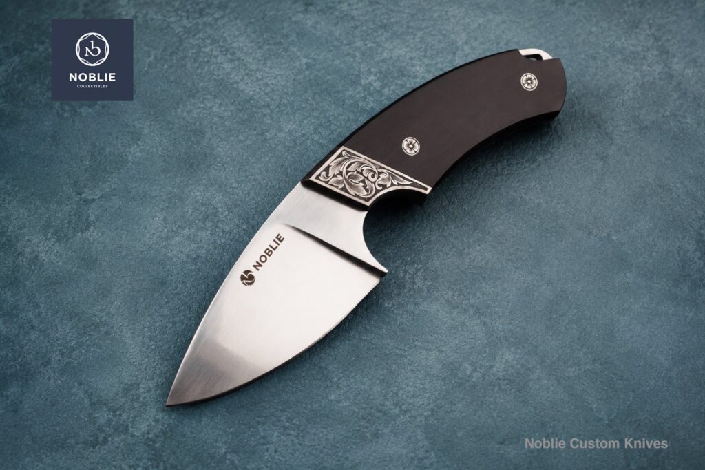 Knife for skinning deer with engraved bolster and black handle